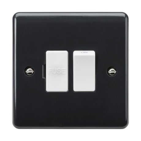 The 13A Switched Fused Spur [Part M Compliant] is a black electrical switch panel with a curved edge design, featuring two white switches. The left switch is labeled FUSE, while the right one is marked ON. This panel is securely mounted with two visible screws and adheres to Building Regulations Part M for improved accessibility.