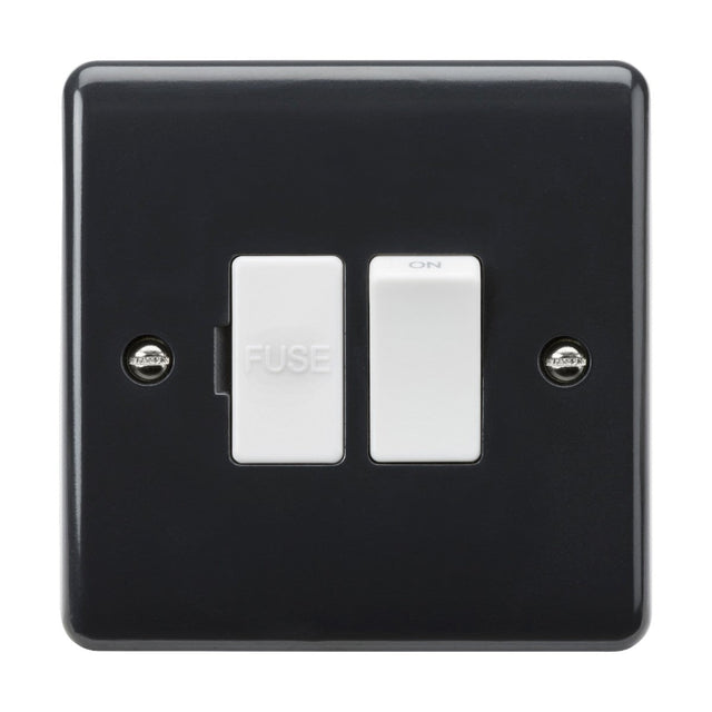 The 13A Switched Fused Spur [Part M Compliant] is a black electrical switch panel with a curved edge design, featuring two white switches. The left switch is labeled FUSE, while the right one is marked ON. This panel is securely mounted with two visible screws and adheres to Building Regulations Part M for improved accessibility.