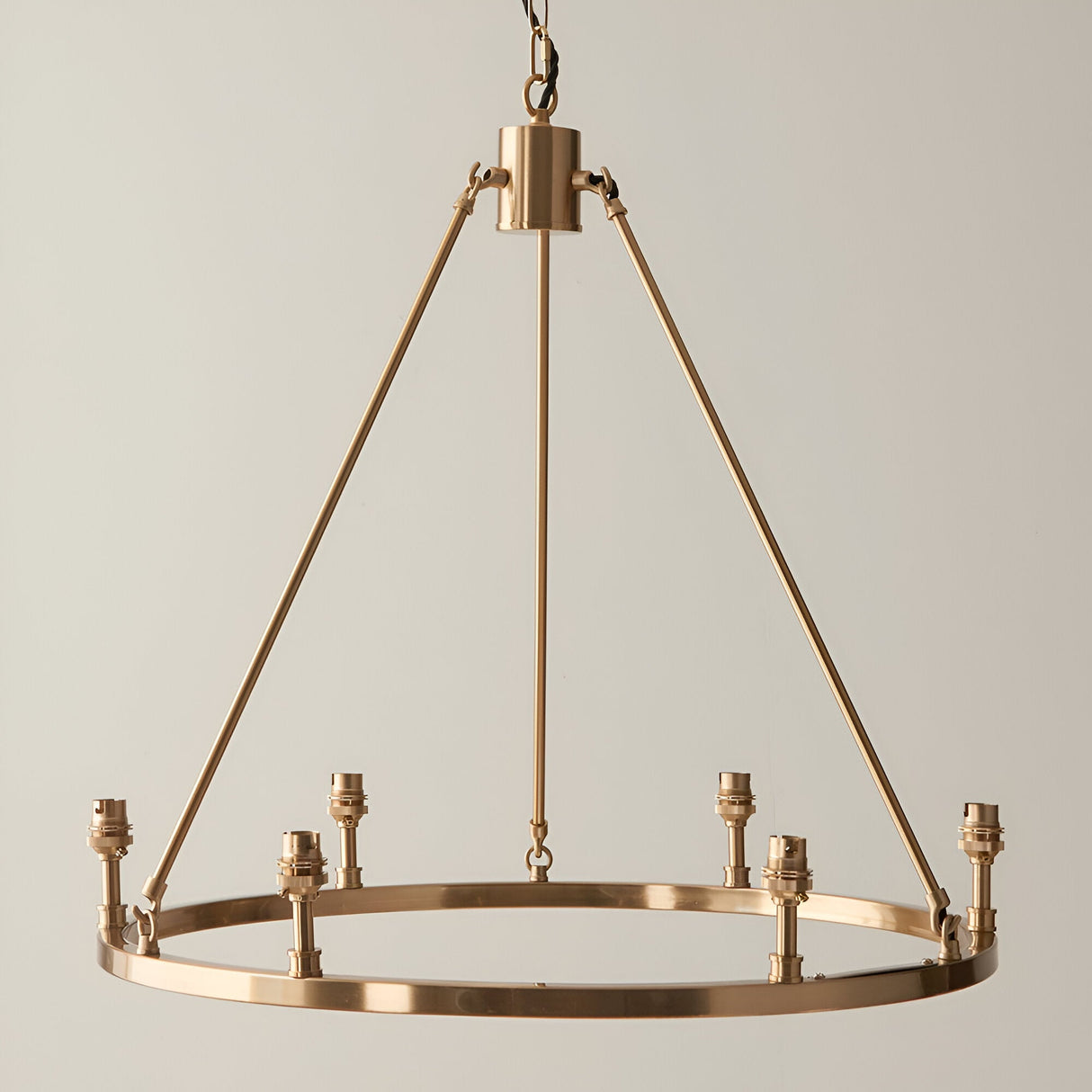 Endon Bevford 6 light hoop pendant in aged brass with B22 lamp holders and black fabric flex chain, shown against a plain light background.