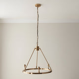 Endon Bevford 3 Light Pendant in aged brass with a hoop frame, B22 lamp holders, and black chain suspension, shown against a plain wall.