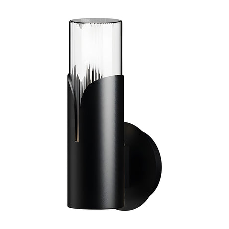 Bisel Cylinder Ribbed Glass Wall Light in matt black, with a clear ribbed glass cylinder set in a curved iron sleeve on a round backplate, shown on a plain white background.