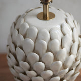 Caldford Small Table Lamp base in cream, close-up of ceramic leaf-shaped textured body with crackle glaze and brass fitting.