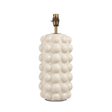 Amberley Table Lamp base in white ceramic with sculptural bobble texture, aged brass stem and B22 bulb holder, shown on a plain white background.
