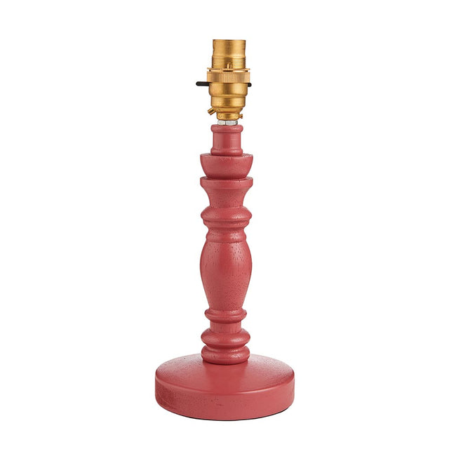 Endon Aldworth turned wood spindle table lamp in satin pink with a brass B22 switched lampholder, shown without a shade on a plain white background.