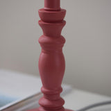 Close-up of the Endon Aldworth table lamp's turned wood spindle in soft pink clay satin finish, shown on a light surface.