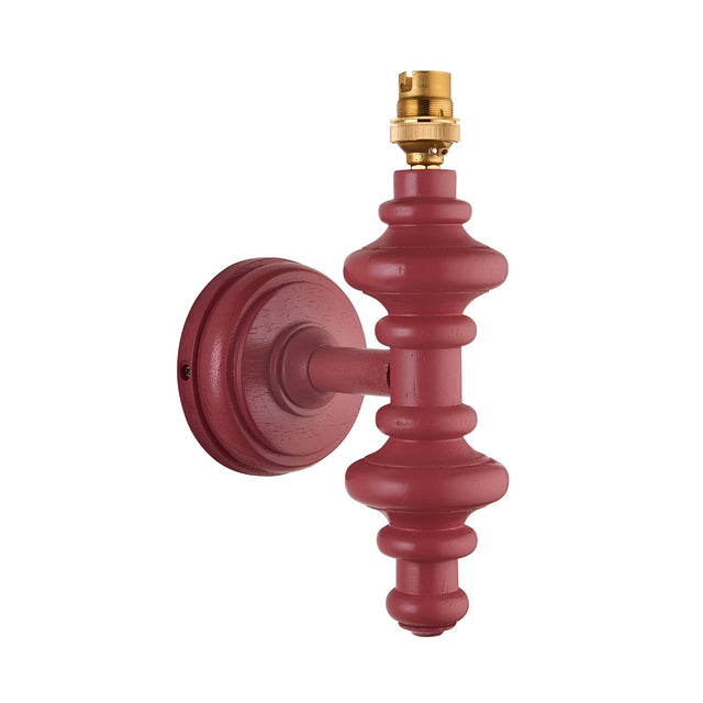 Endon Bevbury wall light with turned wooden spindle in satin pink clay and brass B22 lamp holder, shown without shade on a white background.