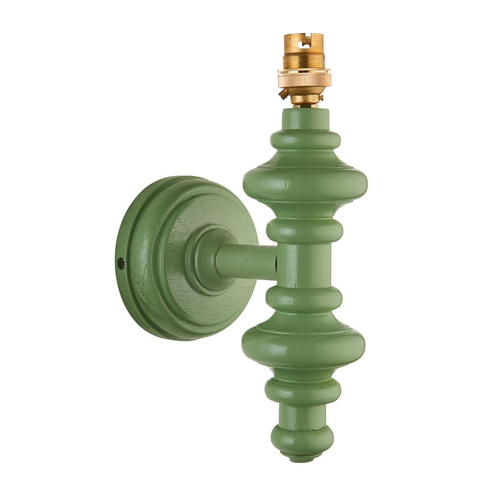 Endon Bevbury turned wooden spindle wall light in Cotswold green satin finish with exposed brass B22 lamp holder, shown on a plain white background.