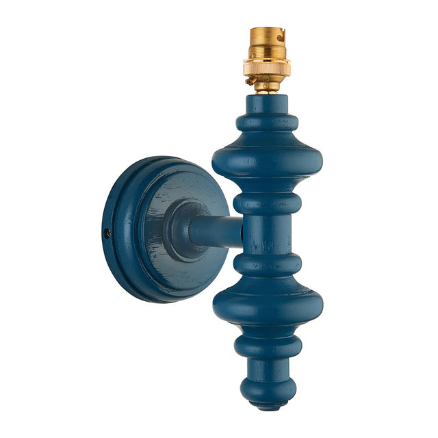 Endon Bevbury wall light with a turned wooden spindle in marlin blue satin finish and exposed brass B22 lamp holder, shown on a plain white background.