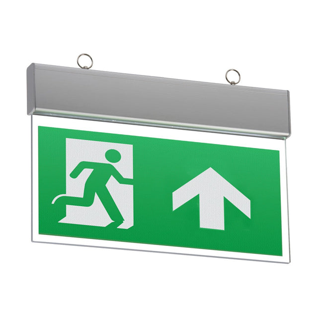 A Ceiling Mounted LED Emergency Exit Sign, featuring a white figure running toward a door and a prominent upward-facing arrow, is mounted on the wall. It showcases an interchangeable legend design within its sleek metallic frame and includes two loops for hanging.