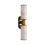 The Lumara 2 Light Twin Tube Alabaster Wall Light features soft white alabaster shades and brushed brass accents, mounted vertically on a matching brass backplate against a white background.