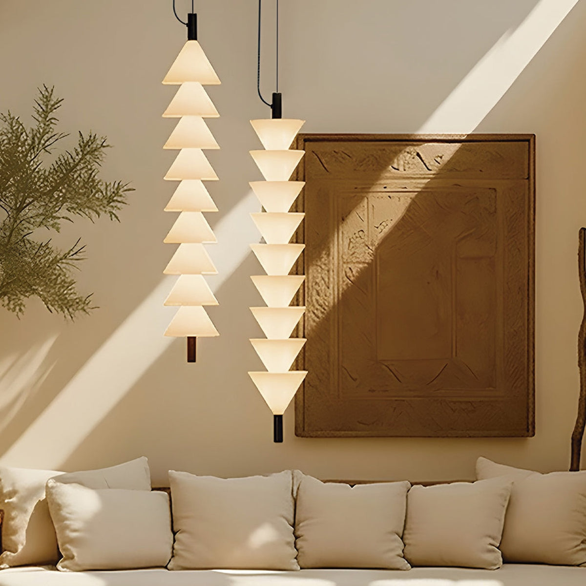 Boga Vertical Up LED Cone Glass Linear Pendant Light in matt black, shown as two stacked columns of upward-facing opal glass cones hanging in a living room above a cream sofa.