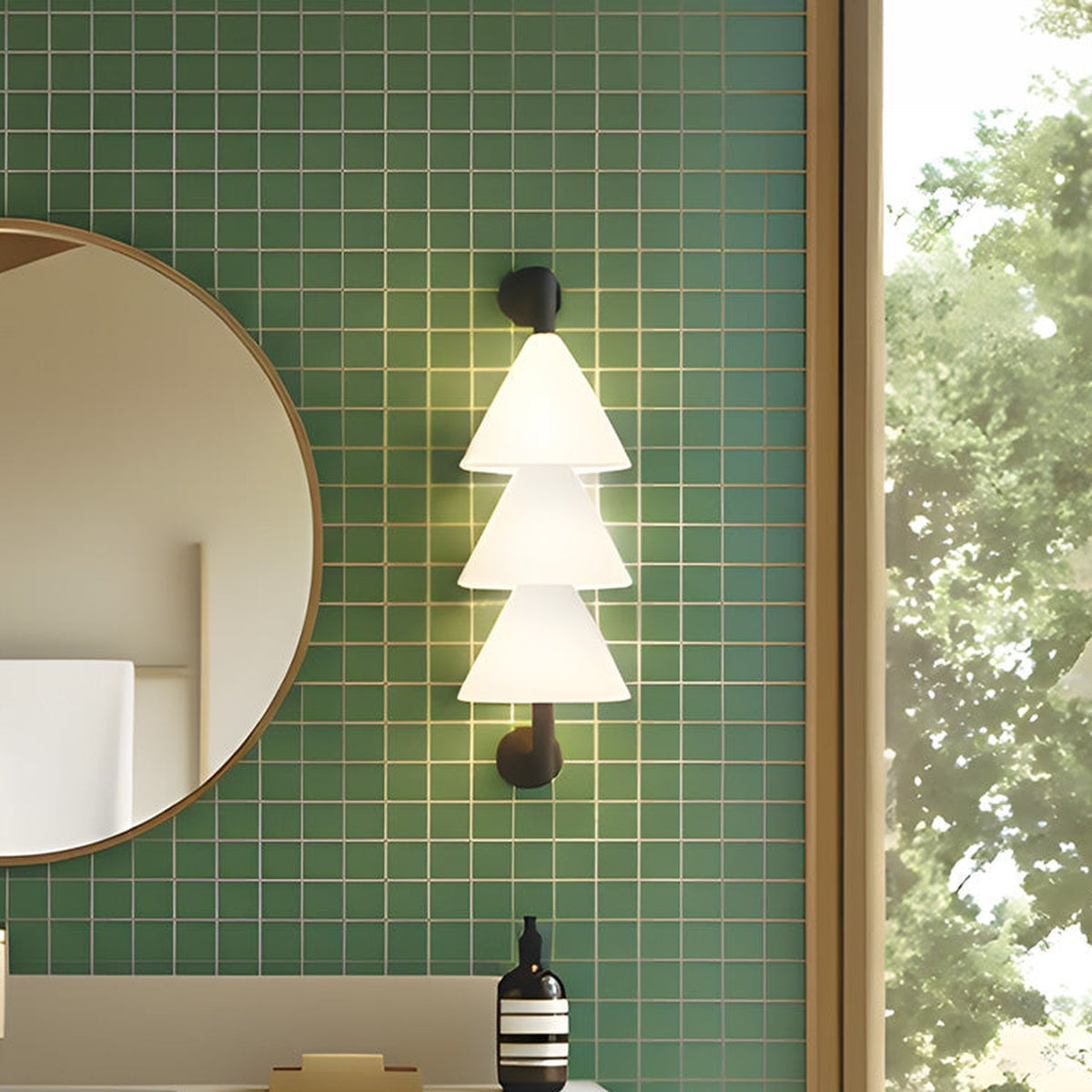 Boga LED Cone Glass Linear Wall Light in matt black with three stacked white glass cone shades, illuminated on a green tiled bathroom wall beside a round mirror.