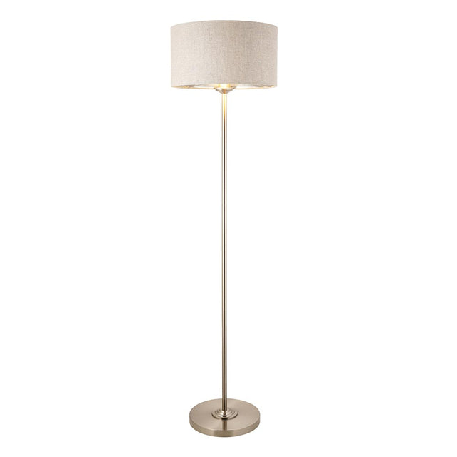Endon Brenley floor lamp in chrome with a slim metal stem, round base, and natural linen drum shade with metallic inner, on a white background.