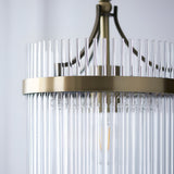 Close-up of the Endon Beaumont pendant showing antique brass ring frame, vertical clear glass rods, and single E27 lamp inside.