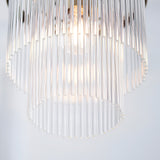 Close-up of Endon Beaumont pendant showing tiered clear glass rods diffusing light from a single E27 lamp within an antique brass fitting.
