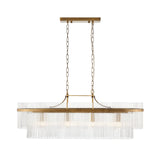 Beaumont 4 Light Linear Pendant in antique brass with clear glass rods along an oval frame, suspended on chains, shown on a plain white background.