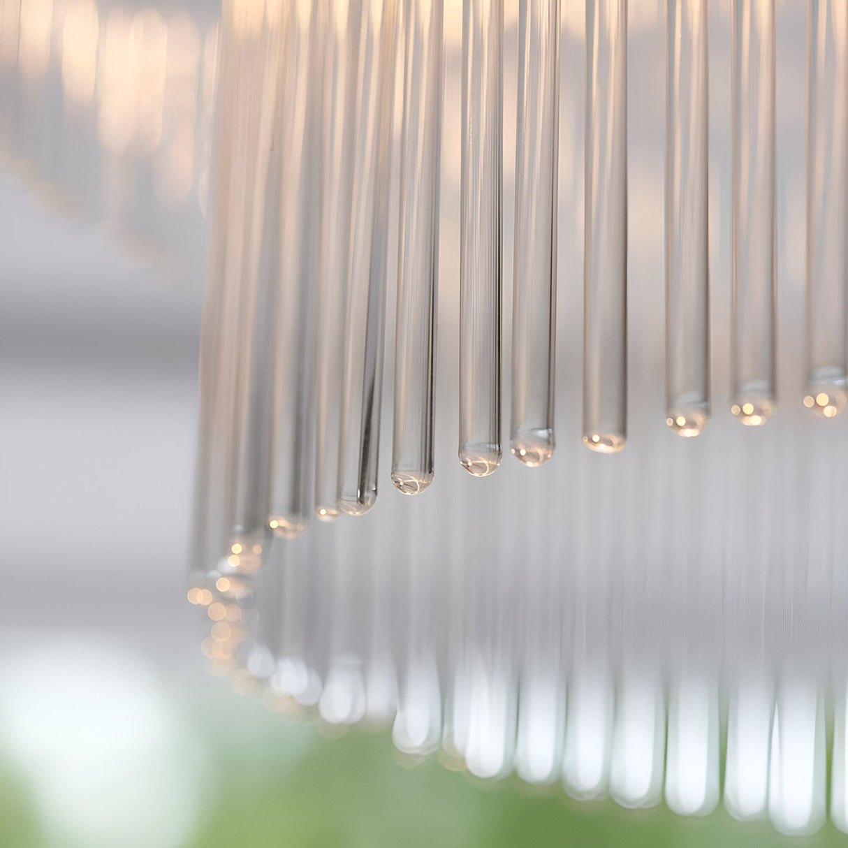 Close-up of the Endon Beaumont semi-flush ceiling light showing its rounded arrangement of clear glass rods with warm light glinting at the tips.
