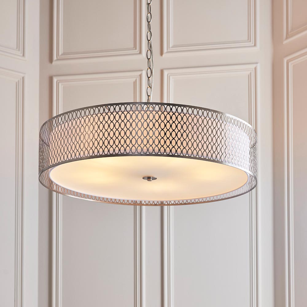 Rosaline 5-light pendant with nickel geometric fretwork outer shade, white fabric inner, and frosted glass diffuser, hung on a chain in a panelled room.