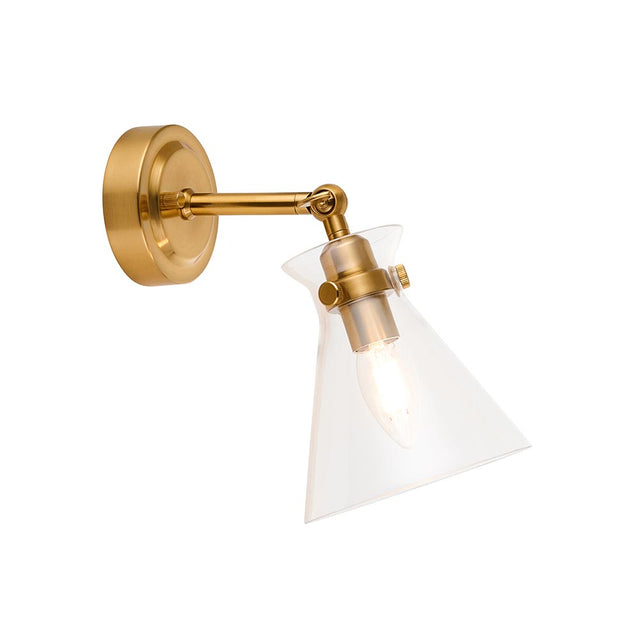 Endon Brenbury wall light in antique brushed brass with adjustable knuckle, clear glass cone shade and exposed E14 bulb, shown on a white background.