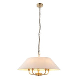 Caldmere 5-light pendant with a wide natural linen drum shade on a brass frame, hung from a chain, shown against a plain white background.