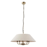 Caldmere 5-light pendant with a wide natural fabric drum shade over a brass five-arm frame, hung from a brass chain on a plain white background.