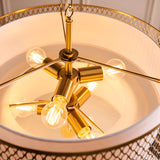 Close-up of Endon Rosaline 6 Light Chandelier in gold, showing six E27 lit bulbs on brass arms within the fretwork drum and white inner shade.