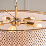 Rosaline 5-light pendant close-up showing gold metal arms with five E27 bulbs beneath a white fabric shade with gold fretwork trim and patterned outer detail.