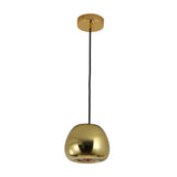 The Gulf Mini Glass Pendant Light - Brass features a modern compact design with a shiny brass dome-shaped shade, suspended from a black cord and complemented by a matching round brass ceiling mount.