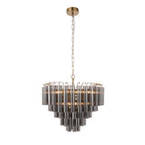 Endon Cranshaw 12 light tiered pendant with smokey grey glass tubes on a satin brass frame, hung from a chain ceiling fixing on a white background.
