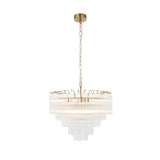 Endon Cranshaw 12 light tiered pendant in satin brass with ribbed clear glass cylinders layered in tiers, suspended on a chain against a white background.