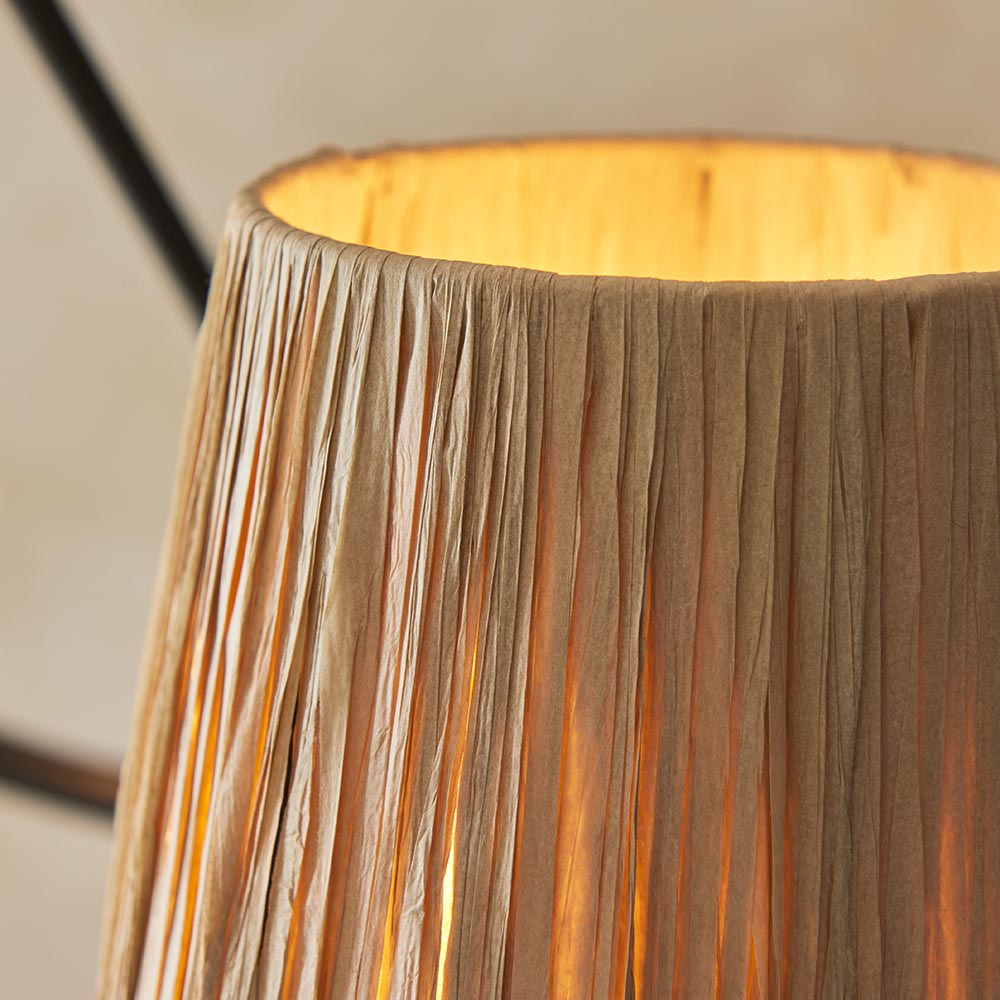 Close-up of Endon Danemont 3 Light Pendant showing a hand-wrapped raffia tapered shade in natural tones, lit from within, on the black wave hoop.