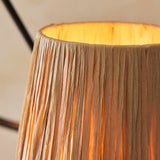 Close-up of Endon Danemont 3 Light Pendant showing a hand-wrapped raffia tapered shade in natural tones, lit from within, on the black wave hoop.