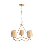 Danemont 3 Light Pendant in brass with a wave-shaped hoop holding three hand-wrapped raffia shades, suspended from a chain on a plain white background.