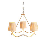 Danemont 3 Light Pendant in brass with a wave-shaped hoop holding three hand-wrapped raffia shades, suspended from a chain on a plain white background.