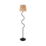 Endon Danemont floor lamp with a matt black wriggle-shaped metal stem, round base and tapered hand-wrapped raffia shade, on a plain background.