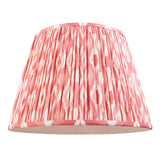 Endon Brackmont pendant shade in handmade pleated faux silk with coral pink Ikat print and taped edges, shown on a plain white background.