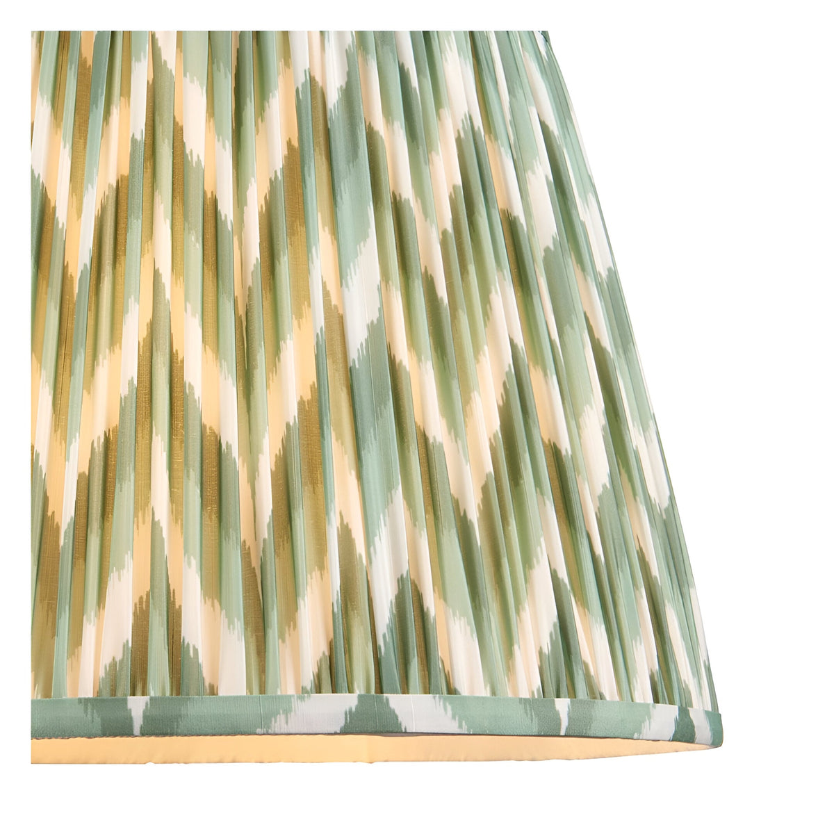 Close-up of the Brackmont Pendant's tapered fabric shade with pleated green, cream, and gold diamond pattern and taped edge trim.