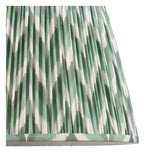 Close-up of the Brackmont Pendant's hand-pleated tapered fabric shade in green and white diamond pattern with taped edge detailing.