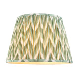 Brackmont Pendant shade in green pleated fabric with a chevron pattern, tapered shape and taped edges, shown on a plain white background.