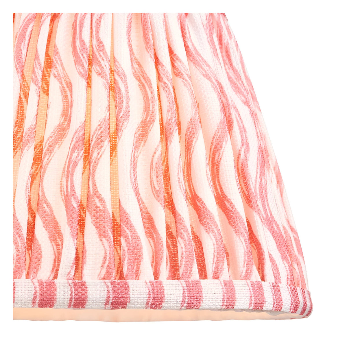 Close-up of the Endon Aldworth Ripple table lamp shade, showing the handmade pleated faux linen in a coral pink and orange ripple print with taped edge.