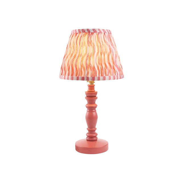 Aldworth Ripple Table Lamp with a coral pink turned spindle base and a handmade ripple-print fabric shade in pink and coral tones, brass fitting.