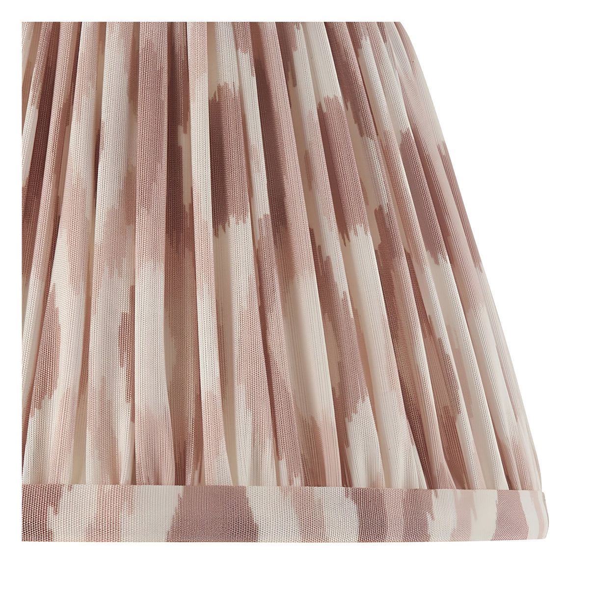 Close-up of the Endon Aldworth Ikat table lamp's pleated faux silk shade in pink clay and natural ikat print with taped trim.