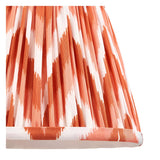 Close-up of the Aldworth Zigzag Wall Light's pleated tapered shade in apricot-orange faux silk with a zigzag pattern and taped edge detailing.