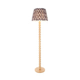 Ashwood Zigzag Floor Lamp with a stacked bamboo sphere base and tapered pearl grey zigzag pleated shade, shown on a plain white background.