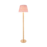 Endon Ashwood floor lamp with stacked natural bamboo sphere stem and coral pink pleated Ripple shade, shown on a plain white background.