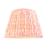 Endon Ashwood floor lamp shade in tapered gathered pleat faux linen with coral pink wave print and striped trim on a white background.
