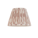 Endon Bevbury Ikat tapered pleated wall light shade in printed faux silk with pink clay and white ikat pattern, shown on a plain white background.