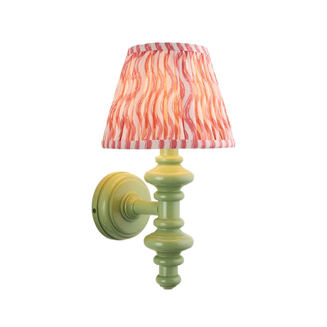Endon Bevbury Ripple wall light with green turned wood spindle, brass B22 lamp holder and pleated pink ripple-print tapered fabric shade.