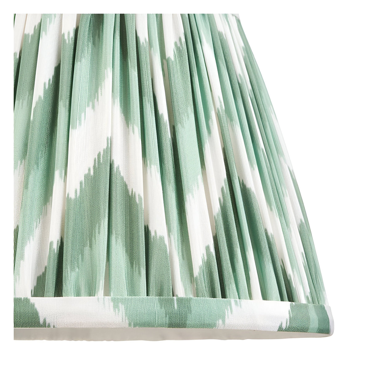Close-up of the Endon Bevbury Zigzag wall light shade in pleated green and white faux silk with a tapered gathered form.