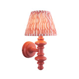 Endon Bevbury Ripple wall light with pink turned wood spindle and tapered pleated faux linen shade in pink ripple print, on a plain white background.